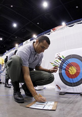 Wildlife Officer scoring results from young archer