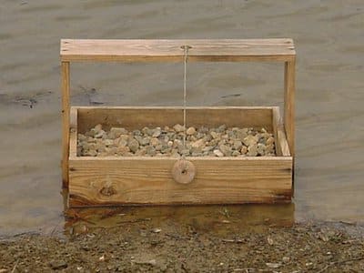 Special spawning boxes were placed in hatchery ponds to help the smallmouth produce offspring.