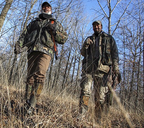 Zell Daniels and Clifton Jackson hunting squirrels