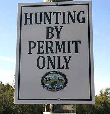Hunting by permit only sign