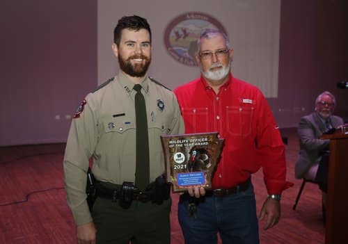 Former NWTF Arkansas chapter president Terry Thompson (right) presented Wildlife Officer Aaron Dillard of Ashley County the National Wild Turkey Federation’s 2021 Arkansas Wildlife Officer of the Year Award.