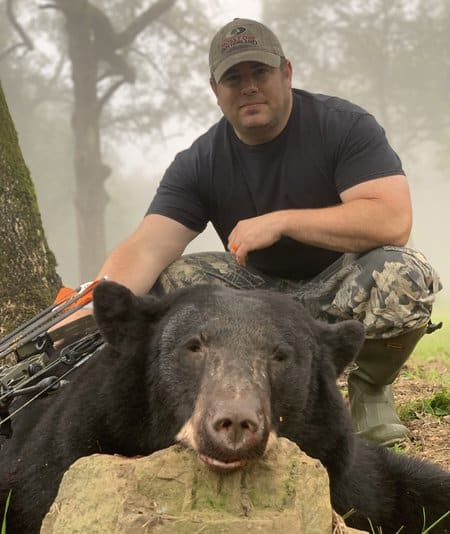 Bear hunter with harvest