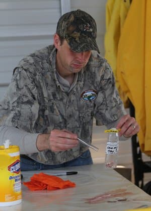 Testing: AGFC Chief of Research Cory Gray gathering samples for delivery to the Arkansas Veterinary Diagnostic Laboratory.