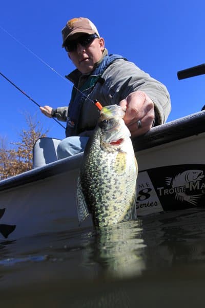 Angler at water: Crappie fishing is much more harvest-oriented than bass or trout fishing, which have strong catch-and-release followings.