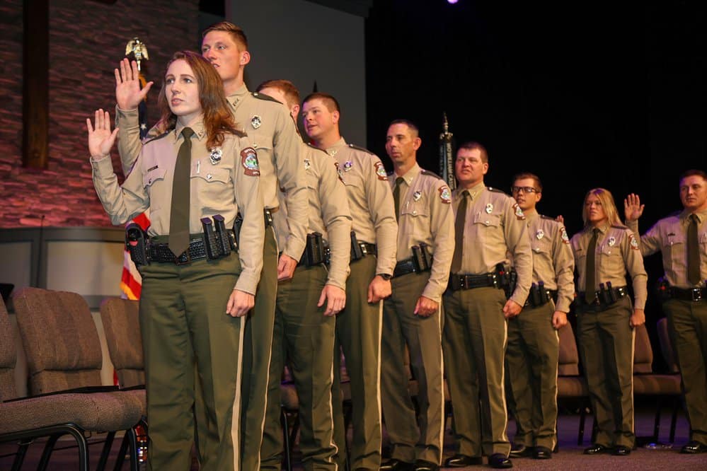 Twelve game wardens graduated the AGFC's training academy last week and took their oaths to enforce the law.