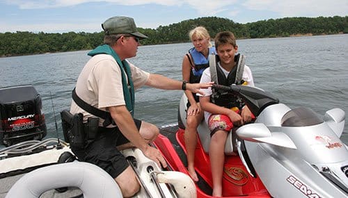 Officer talking to people on Sea Doo