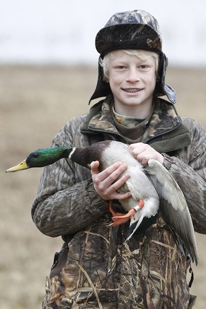 Student working with waterfowl biologists in wildlife experience course