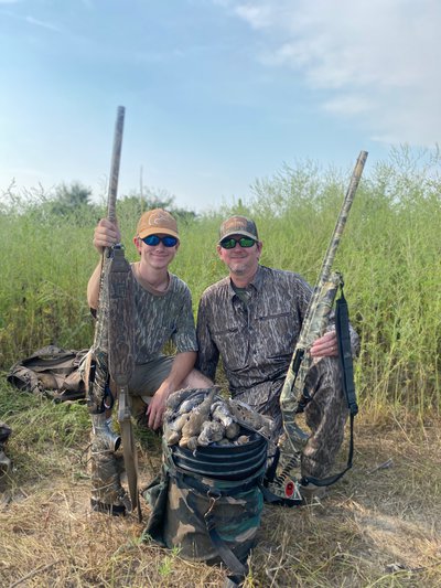 Dugger with son after successful dove hunt