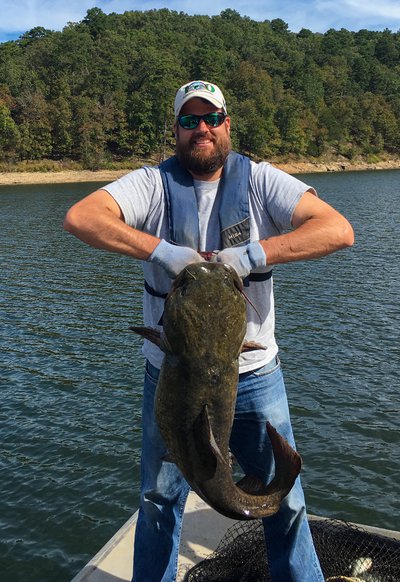 Ben Batten, Deputy Director with large catfish