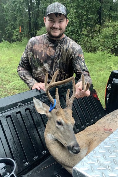 Joey Ring stands with his opening morning velvet buck