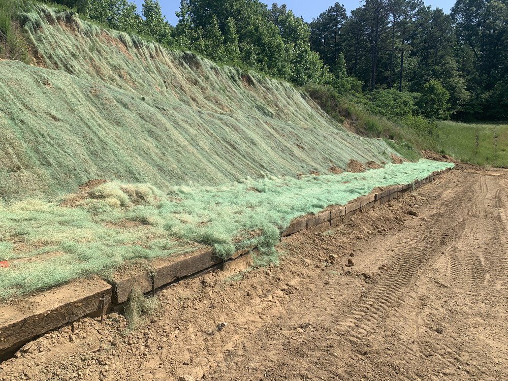 The backstop at the range was repacked and seeded, and a railroad tie barrier was placed at its base to help prevent future erosion.