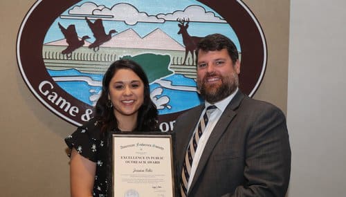 AGFC Social Scientist Jessica Feltz (left) was recognized by AGFC Fisheries Chief Ben Batten for earning the Award for Excellence in Public Outreach from the International American Fisheries Society for her work in 2021.