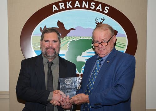 Jon Stein: AGFC Regional Fisheries Supervisor Jon Stein (left) received the Mike Freeze Fisheries Biologist of the Year award from its namesake.
