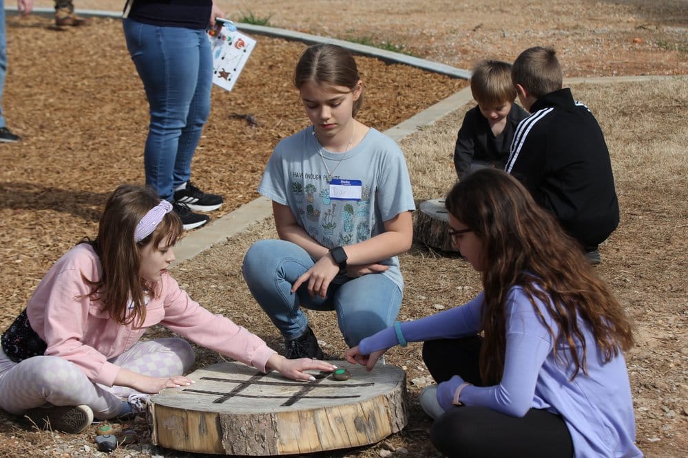 Unique playstations built of repurposed natural materials encourage youth to use creativity and imagination while enjoying a day outside at the center.