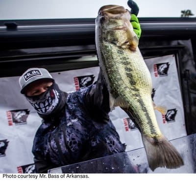 Angler with mask at weigh in.