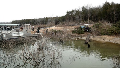 Loading trees onto barge