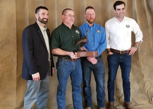 Group shot (from left to right): NWTF District Biologist Jeremy Everitts, AGFC Biologist Jason Mitchell, AGFC Turkey Program Coordinator Jeremy Wood and AGFC Director Austin Booth celebrate Mitchell’s achievement at the 2022 NWTF National Convention.