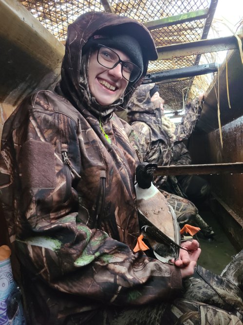 Hunter with Duck: Misty Boatman, a UCA student who participated in the program, with her first duck. Photo by Luke Naylor, AGFC.