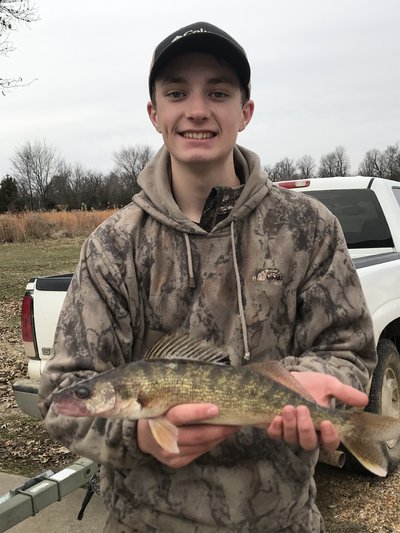 Young man with walleye catch