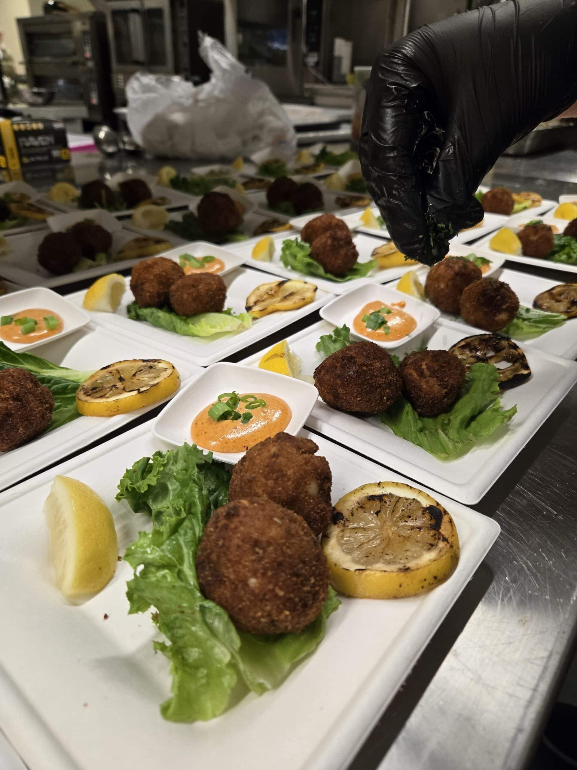 Small balls of fish served with lemon.