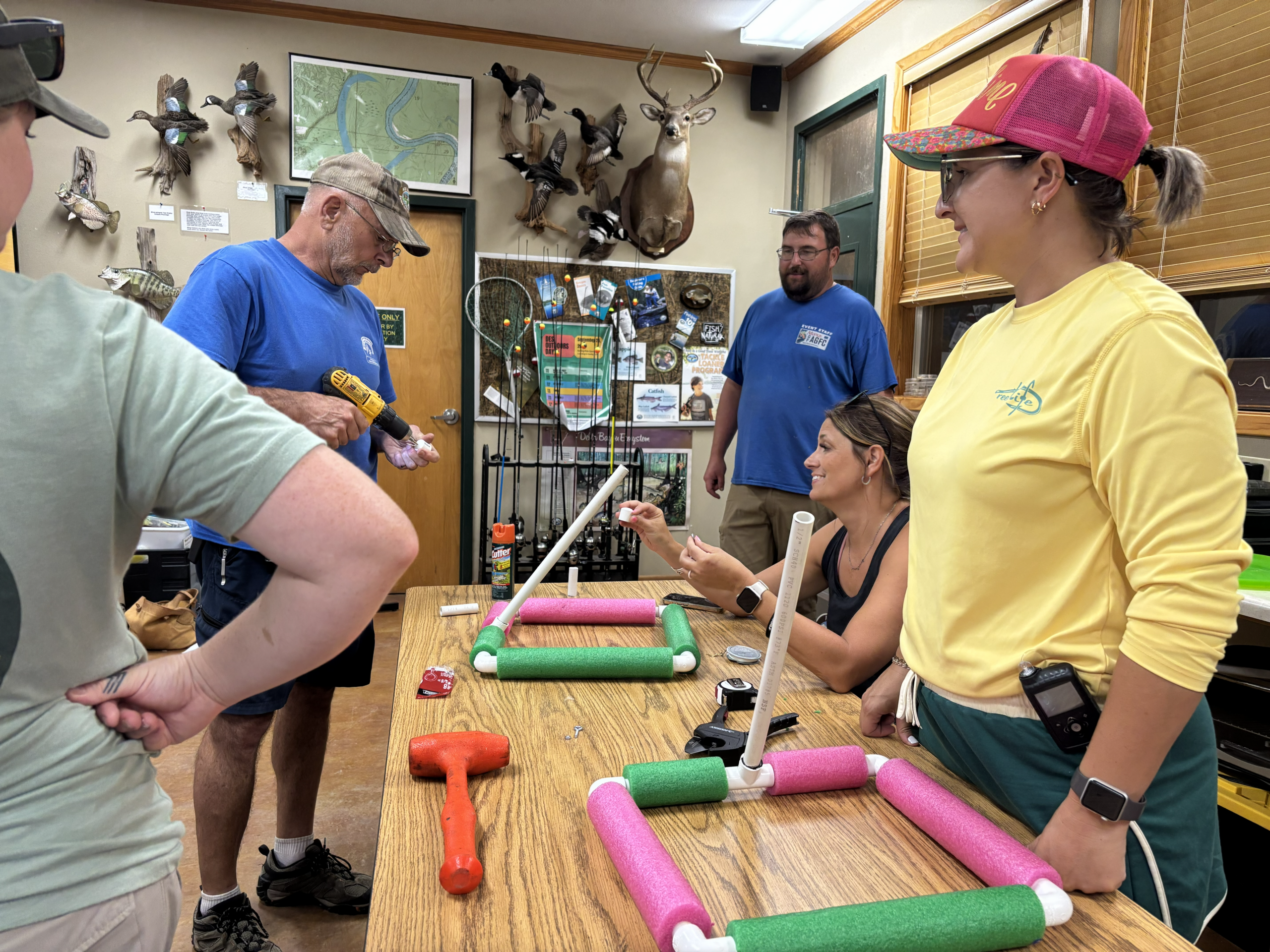 Teachers learning how to build homes for fish to put in waterbodies.