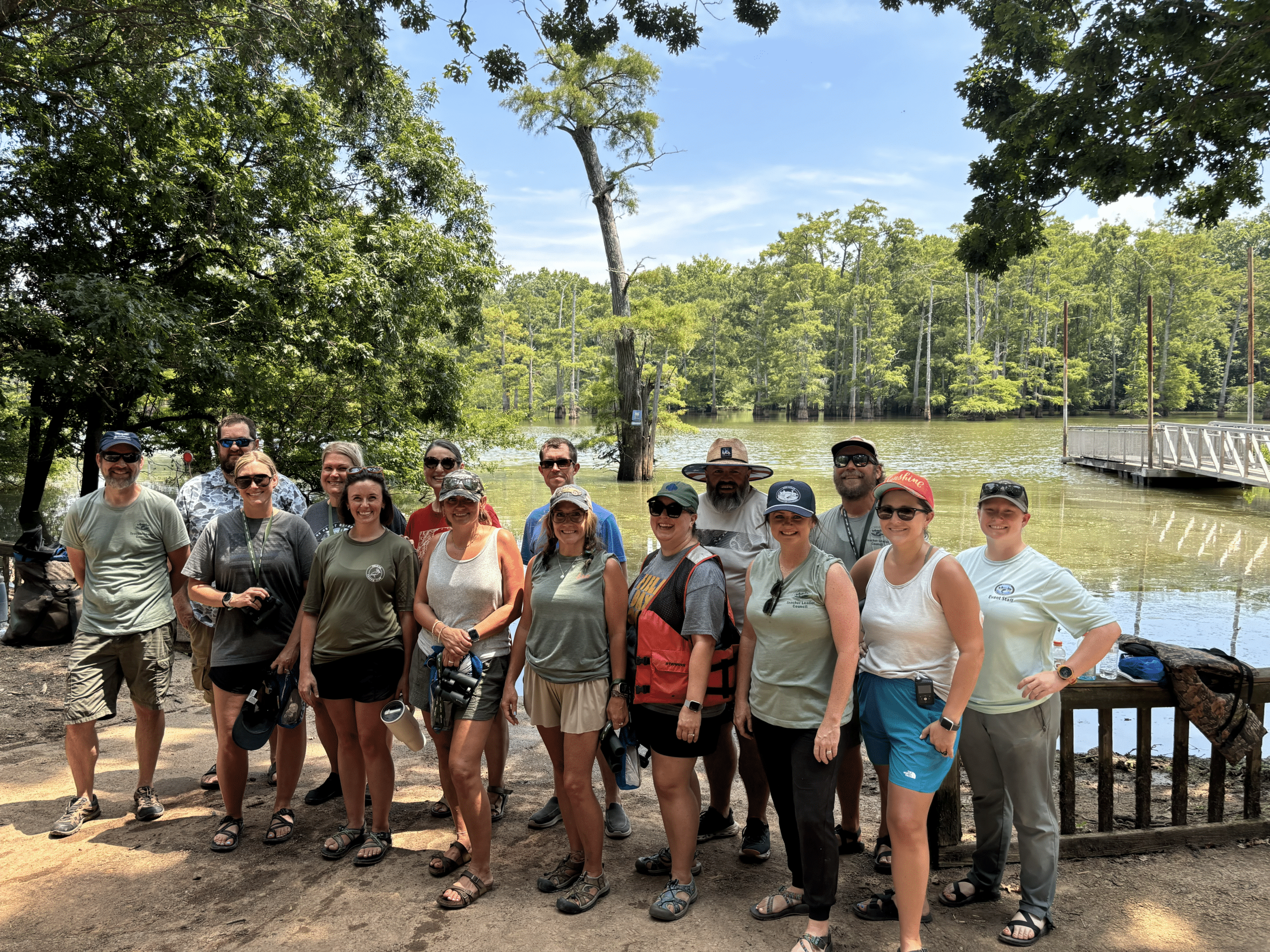 A group of smiling teachers posing for the picture.